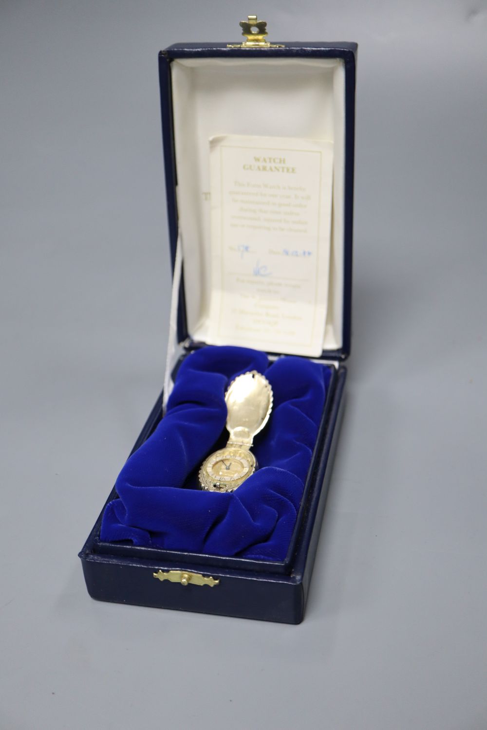 A modern limited edition St. Jamess House Company parcel gilt silver pendant watch, of shell form,